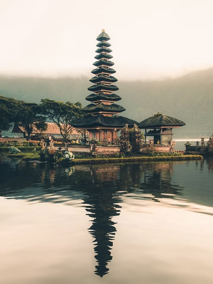 A Balinese temple reflected in a still lake